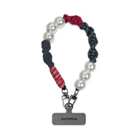 Auren hand-braided wristlet hanging with strap card in natural light