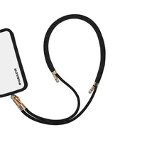 Adjustable black phone crossbody strap secured to iPhone charging port