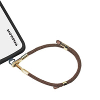 Adjustable Caramel Brown phone strap at iPhone charging port