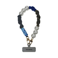 Hades wristlet in hand-braided TENCEL™ hanging with clasped strap card