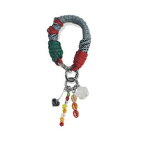 Lyra handle in hand-braided TENCEL™ hanging with charm attachments