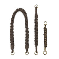 Exploded view of hand-braided straps: Shoulder carrier (caramel brown), wristlet band, key handle charm