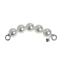 Side profile of pearl handle strap with silver clasps apart, easy to attach.