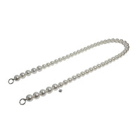 Side profile of pearl rope strap with separated silver clasps, displaying easy attachment points.