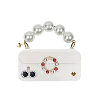 Handle strap attached to phone case via strap-ready ears on the case.