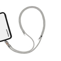 Adjustable silver phone crossbody strap connected to iPhone charging port
