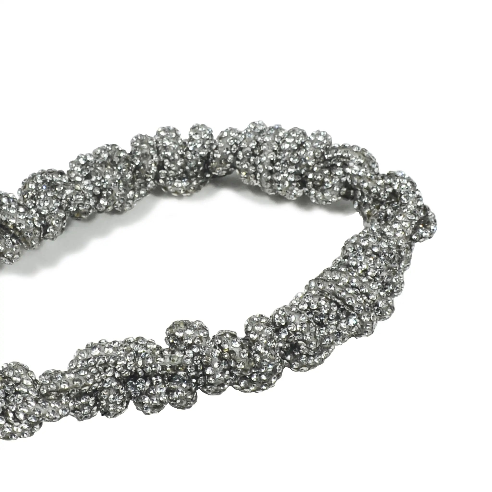Artisanal crystal braiding detail with silver metal clasp
