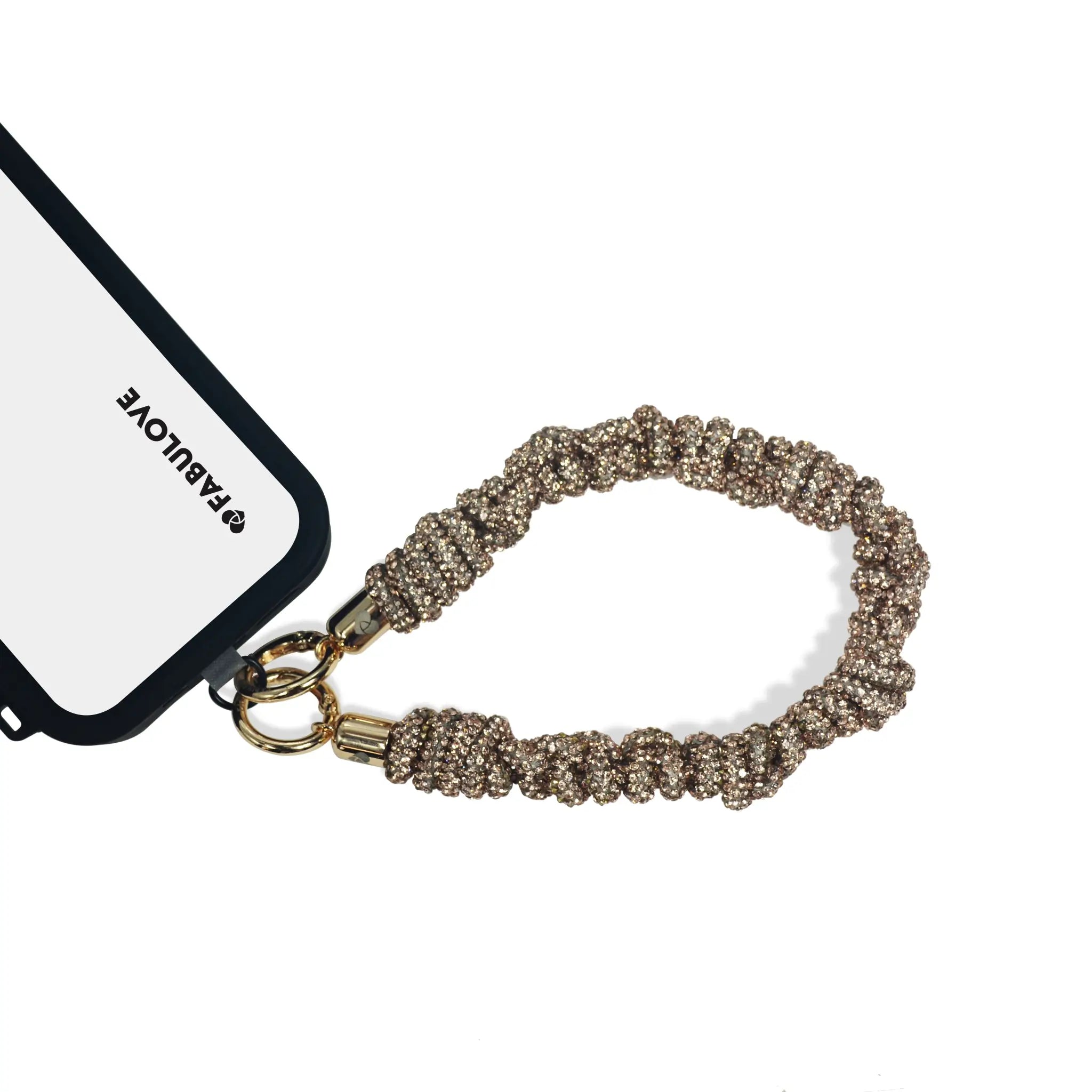 Crystal wrist strap secured to phone via charging port with strap card