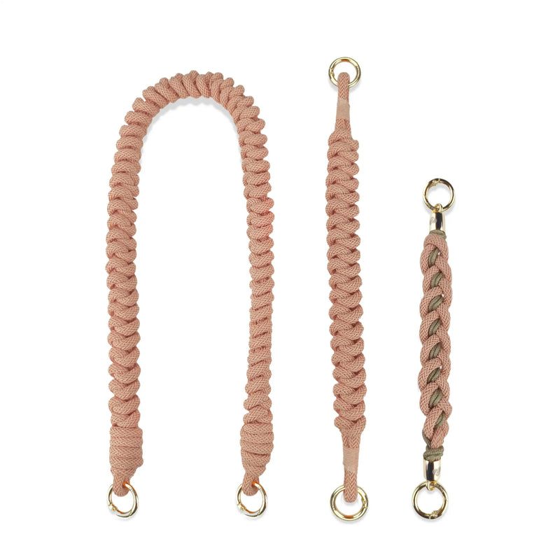 Component breakdown for peach orange straps: Shoulder-length segment, wristlet safety band, handle charm at 5-degree angle