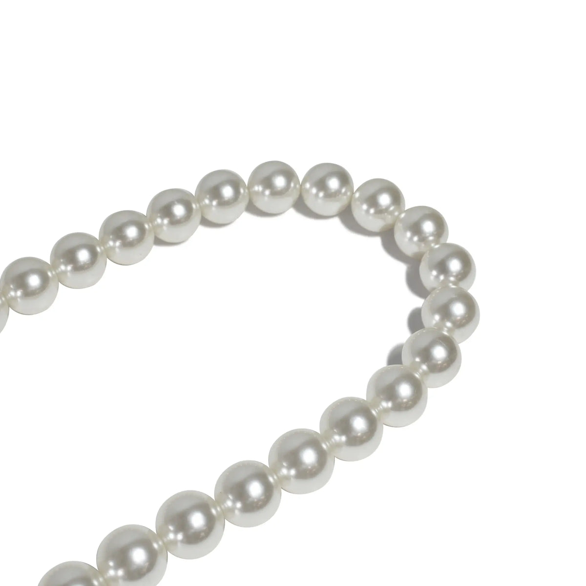 Close-up of high-quality pearl beads on rope strap, highlighting texture and durability