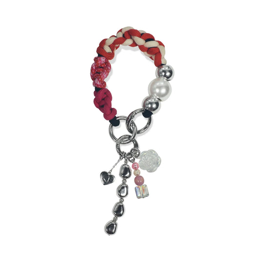 Hand-braided TENCEL™ handle in Rhea hanging with charm elements