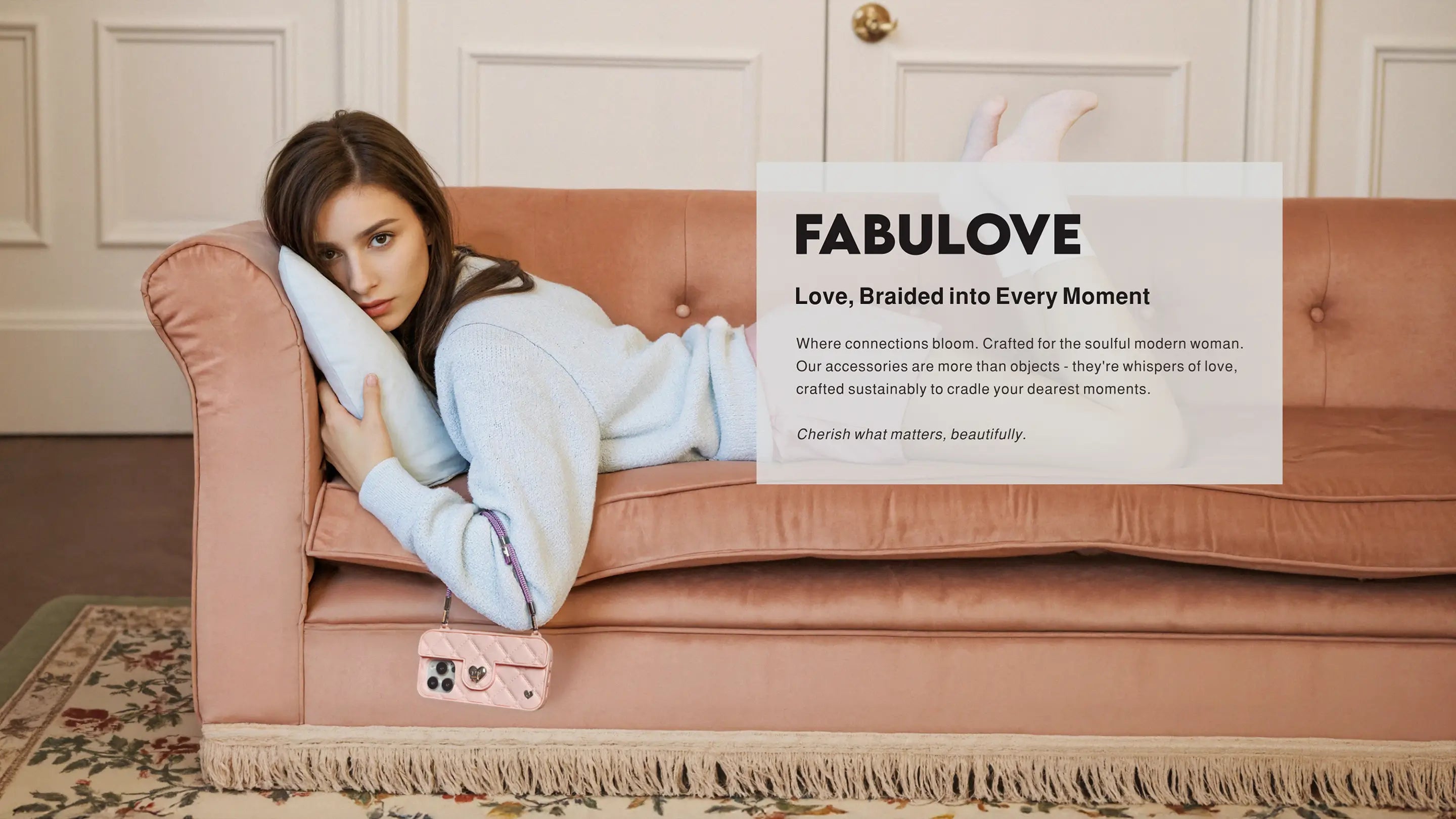 Soulful modern woman resting on sofa with Amethyst Purple Bling Bling wristlet connecting to Flamingo SOL purse case. Love, braided into every moment where connections bloom - crafted sustainably to cradle your dearest moments.